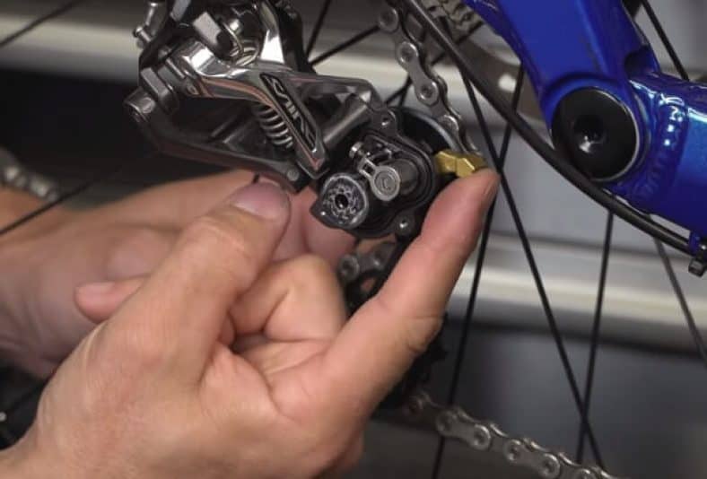 What is the difference between a long cage and short cage derailleur?